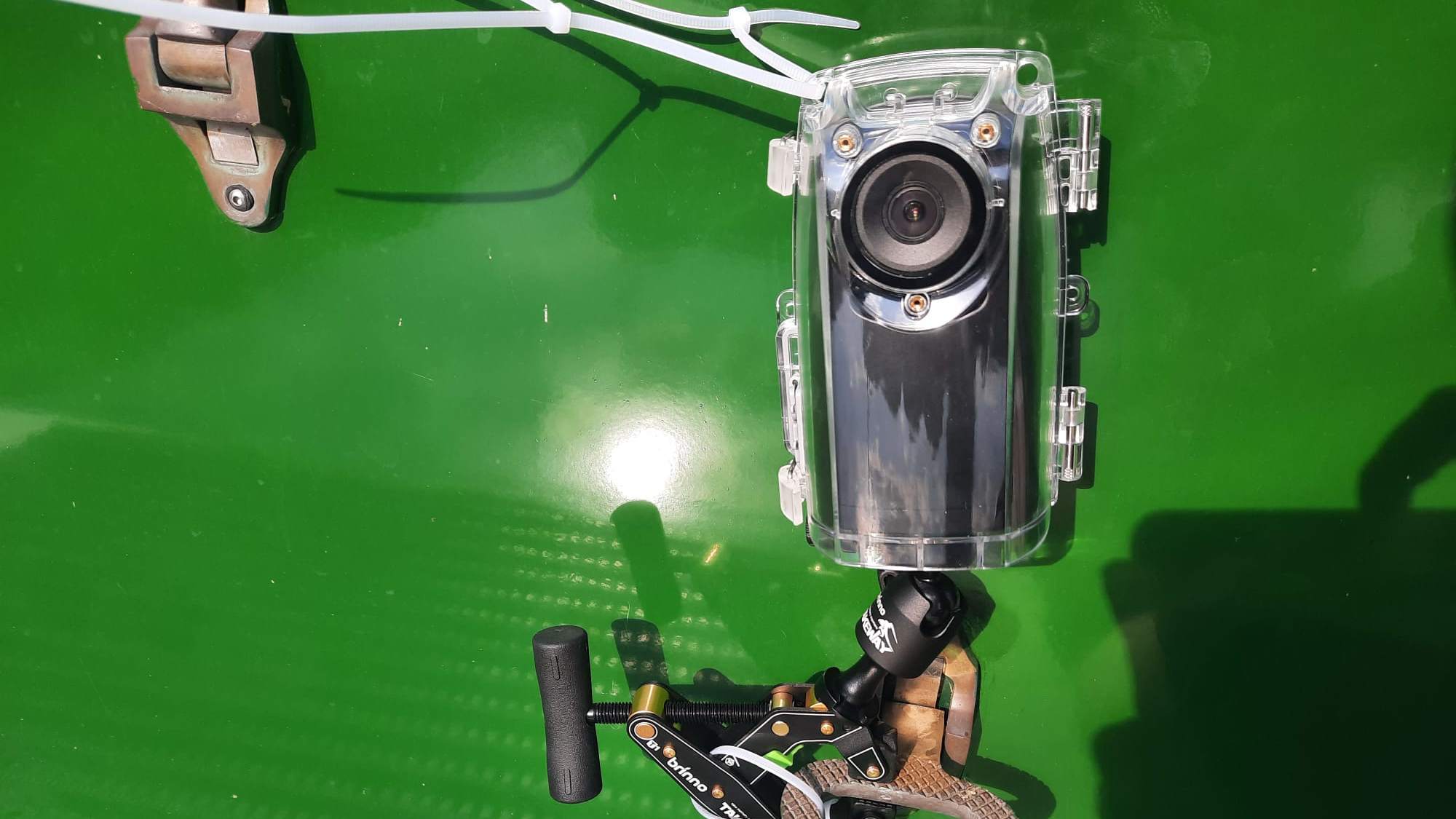 Photograph of Brinno BCC300-C mounted to the side of a boat with clampod and cable ties