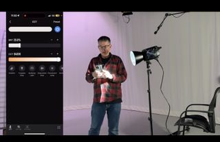 Man using a Zhiyun Molus B500 light in a studio