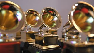 Four Grammy awards sat on a table