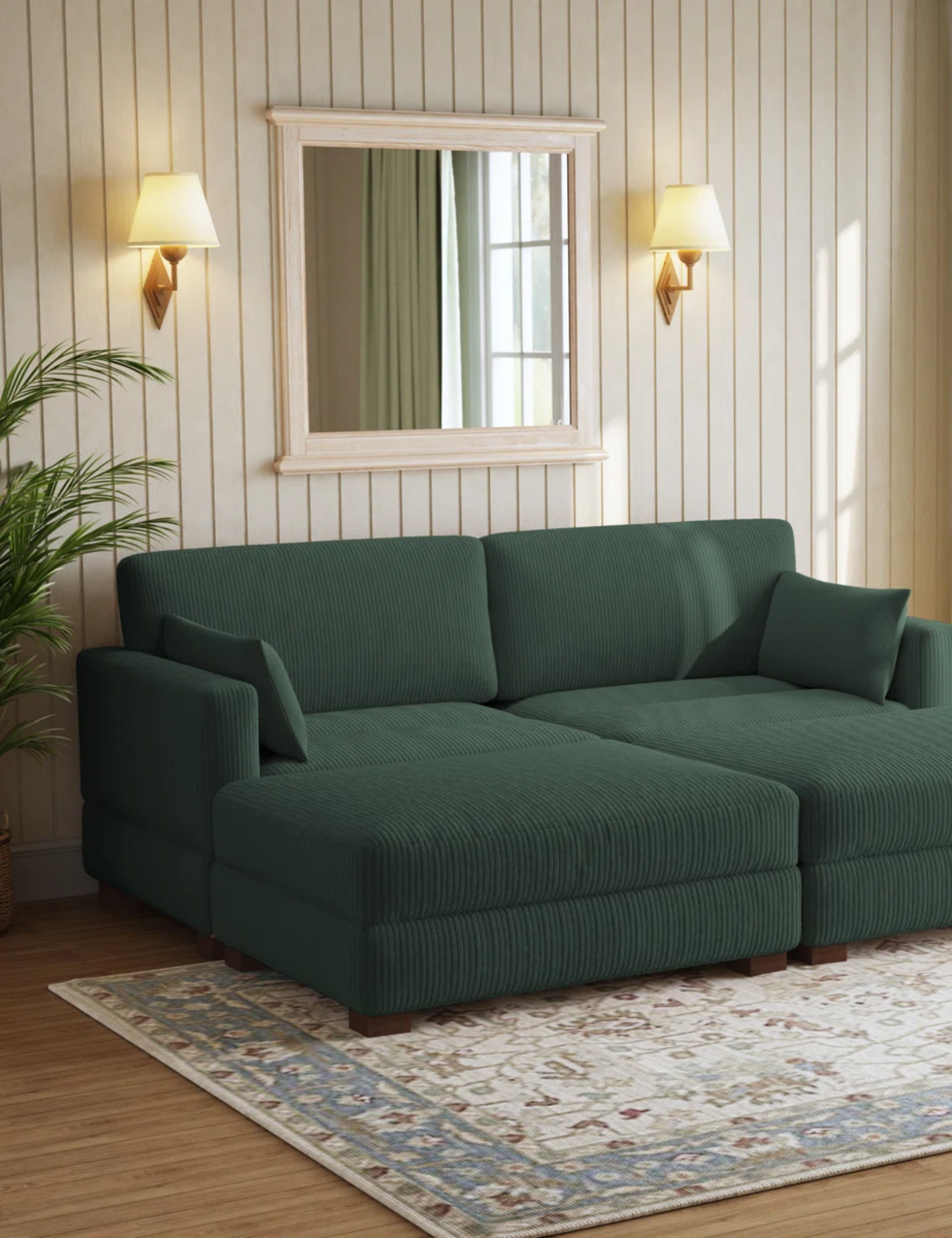 Green Wayfair sleeper sofa styled in a neutral wood-paneled living room