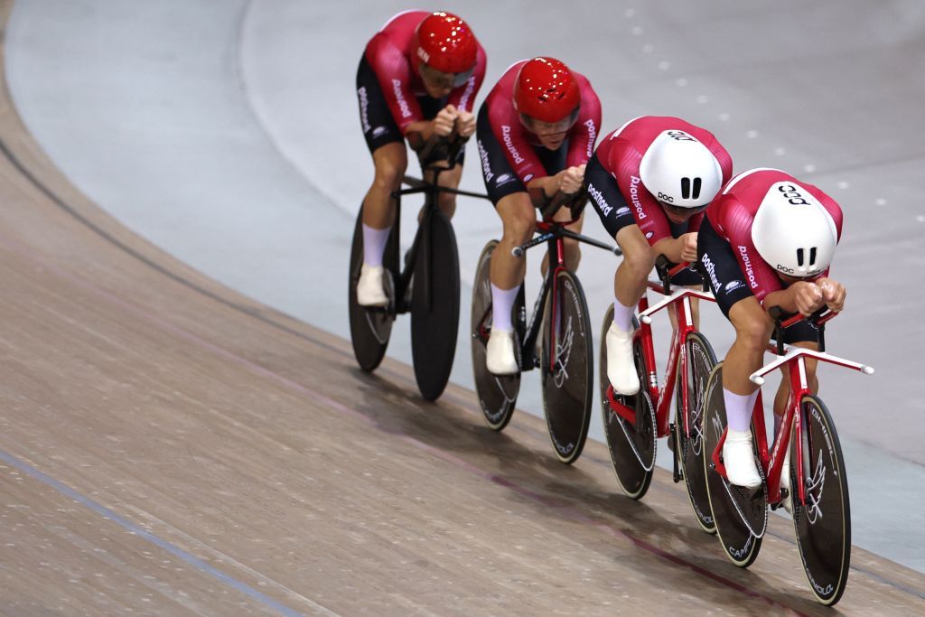 Danish team riders Lasse Norman Hansen Tobias Hansen CarlFrederik Bevort and Rasmus Pedersen compete in the Mens Team Pursuit finals during the UCI Track Cycling World Championships at the Velodrome of SaintQuentinenYvelines southwest of Paris on October 13 2022 Photo by Thomas SAMSON AFP Photo by THOMAS SAMSONAFP via Getty Images