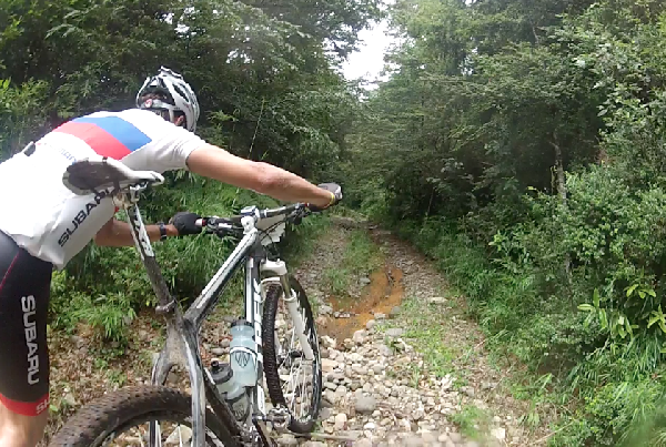 The Chilean national champ, leading the open men's duo category, walks his bike up one of the many 30% slopes