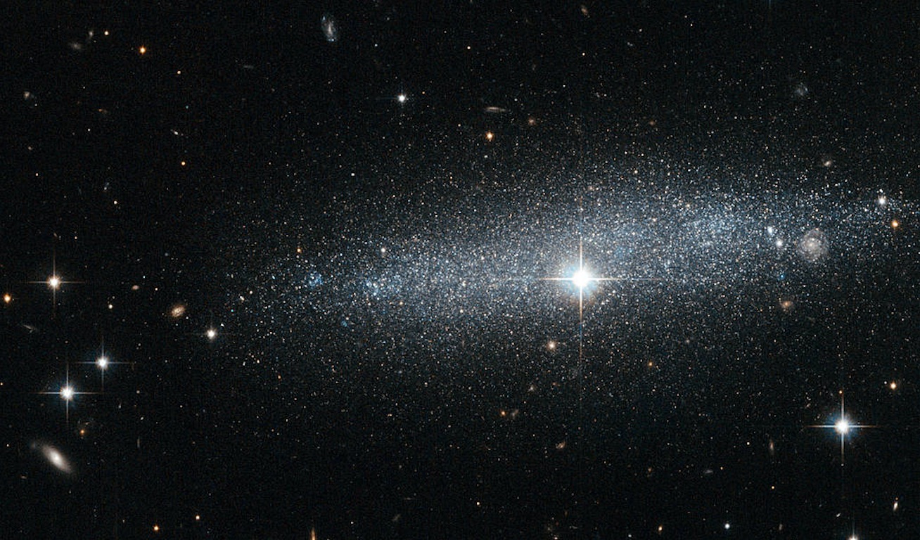 A close-up view of the dwarf galaxy ESO 318-13 with glittering stars.