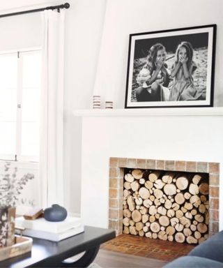 white living room with oversized black and white family photo on the wall