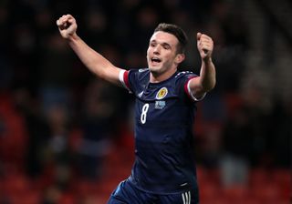 John McGinn celebrate wrapping up victory for Scotland with his second goal of the match