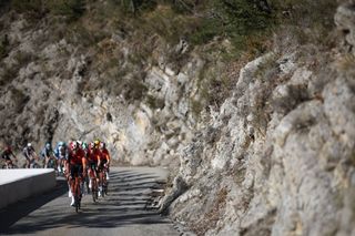 The pack of riders (peloton) cycles in the ascent of Col de la Porte during the 8th and final stage of the Paris-Nice cycling race, 119,9 km between Nice and Nice, on March 16, 2025. (Photo by Anne-Christine POUJOULAT / AFP)