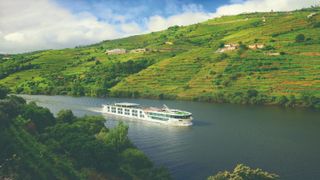 Scenic Azure river ship sailing in the Douro valley