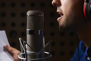 Man Talking into Microphone