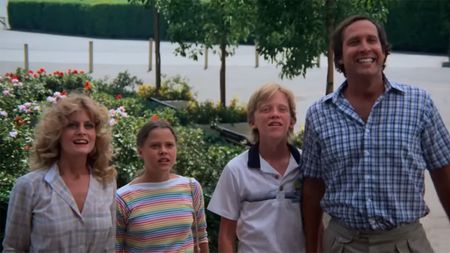 4K look at Beverly D'Angelo, Chevy Chase and the kids in National Lampoon's Vacation standing in front of flower beds. 