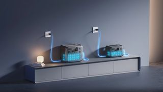 A pair of Bluetti AC2A & AC70 power stations sitting on a cabinet and charging through AC outlets