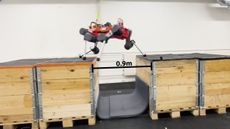 The four-legged dog-like robot jumping between boxes