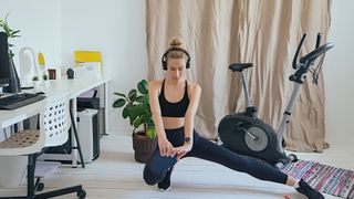a photo of a woman working out in a home gym
