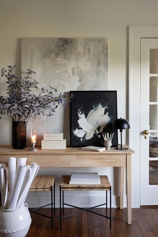An entryway console table with candle