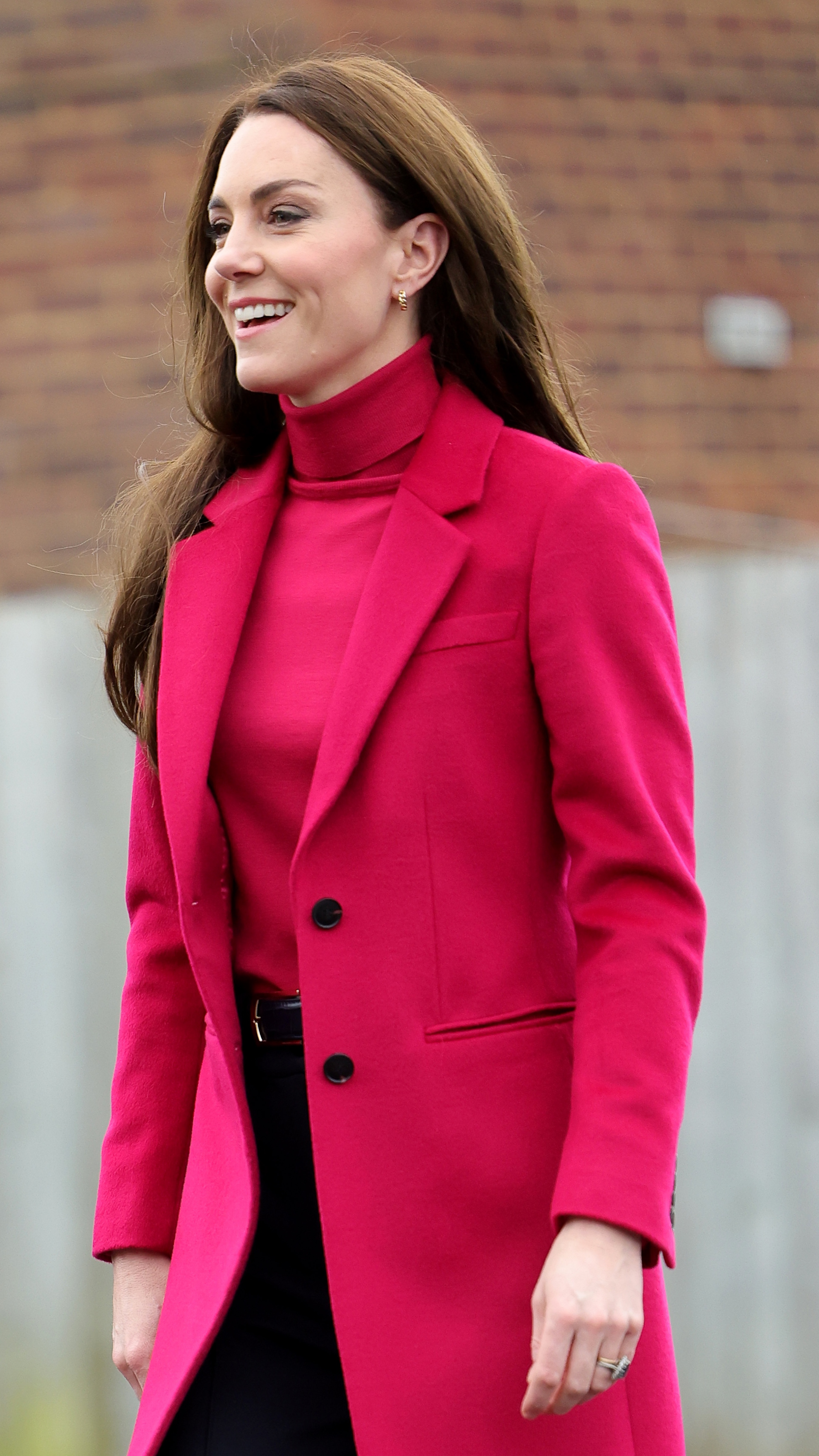 Catherine, Princess of Wales smiles as she arrives for the visit to Windsor Foodshare