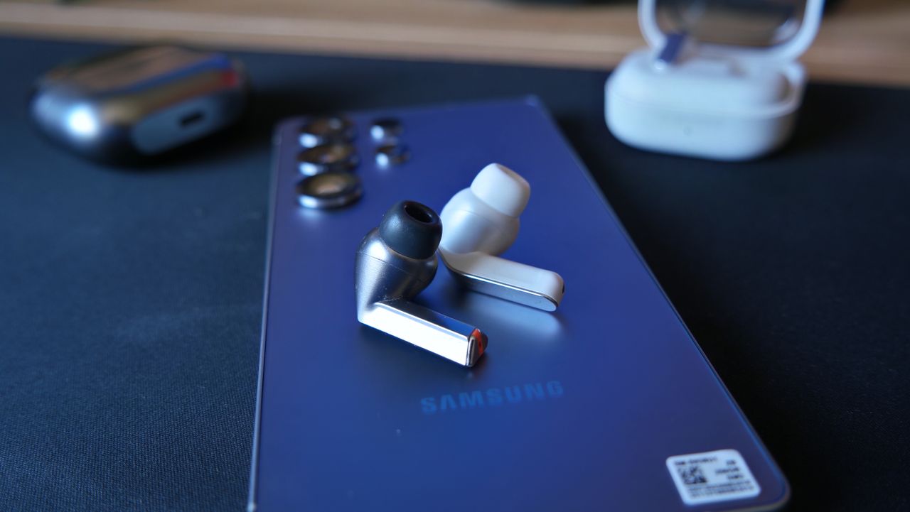 Galaxy Buds 4 Pro on a desk, next to Galaxy Buds3 Pro