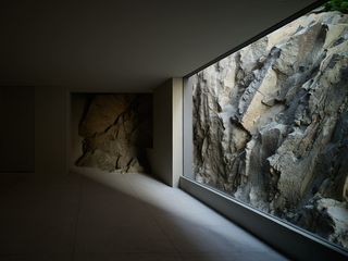 exposed rock wall in minimalist mexican house