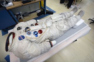 Exhibited for decades in the National Air and Space Museum's Apollo to the Moon gallery, Buzz Aldrin's Apollo 11 spacesuit rests in the conservation hangar at the museum's northern Virginia annex, the Steven F. Udvar-Hazy Center. Aldrin's spacesuit will remain off-display as Neil Armstrong's suit is returned to the National Air and Space Museum after 13 years off public display.