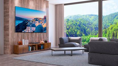 LG G2 TV mounted to the wall in airy living space with grey fabric sofa set and floor to ceiling windows