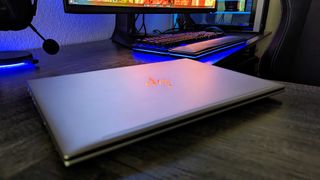 Image of the HP ZBook Firefly 14" (G10) closed on a desk, showing light reflecting in the "HP" logo.