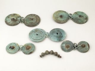 Bronze brooches were discovered in two stashes of artifacts in Transylvania.