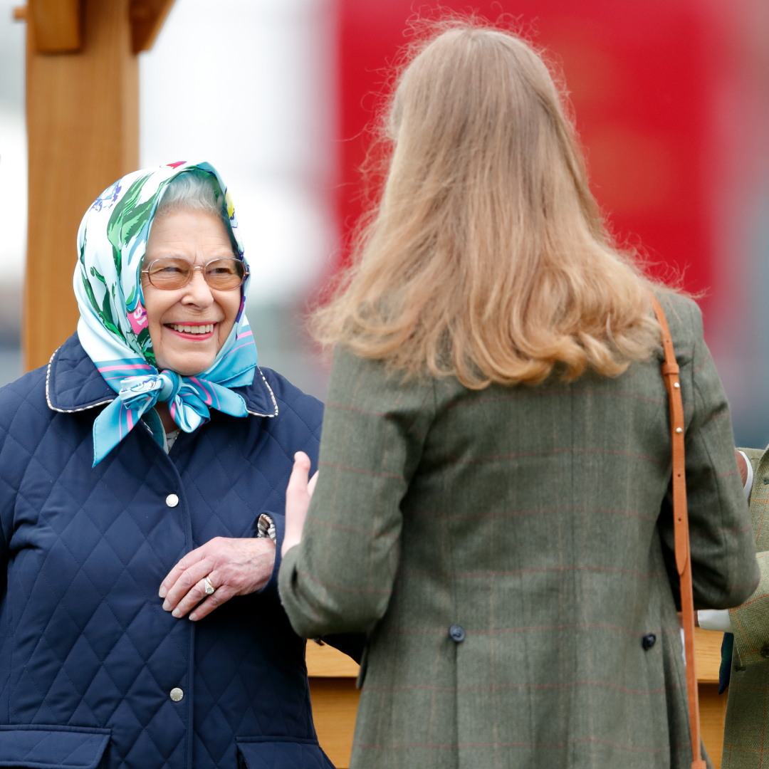 Queen Elizabeth smiling at Lady Louise