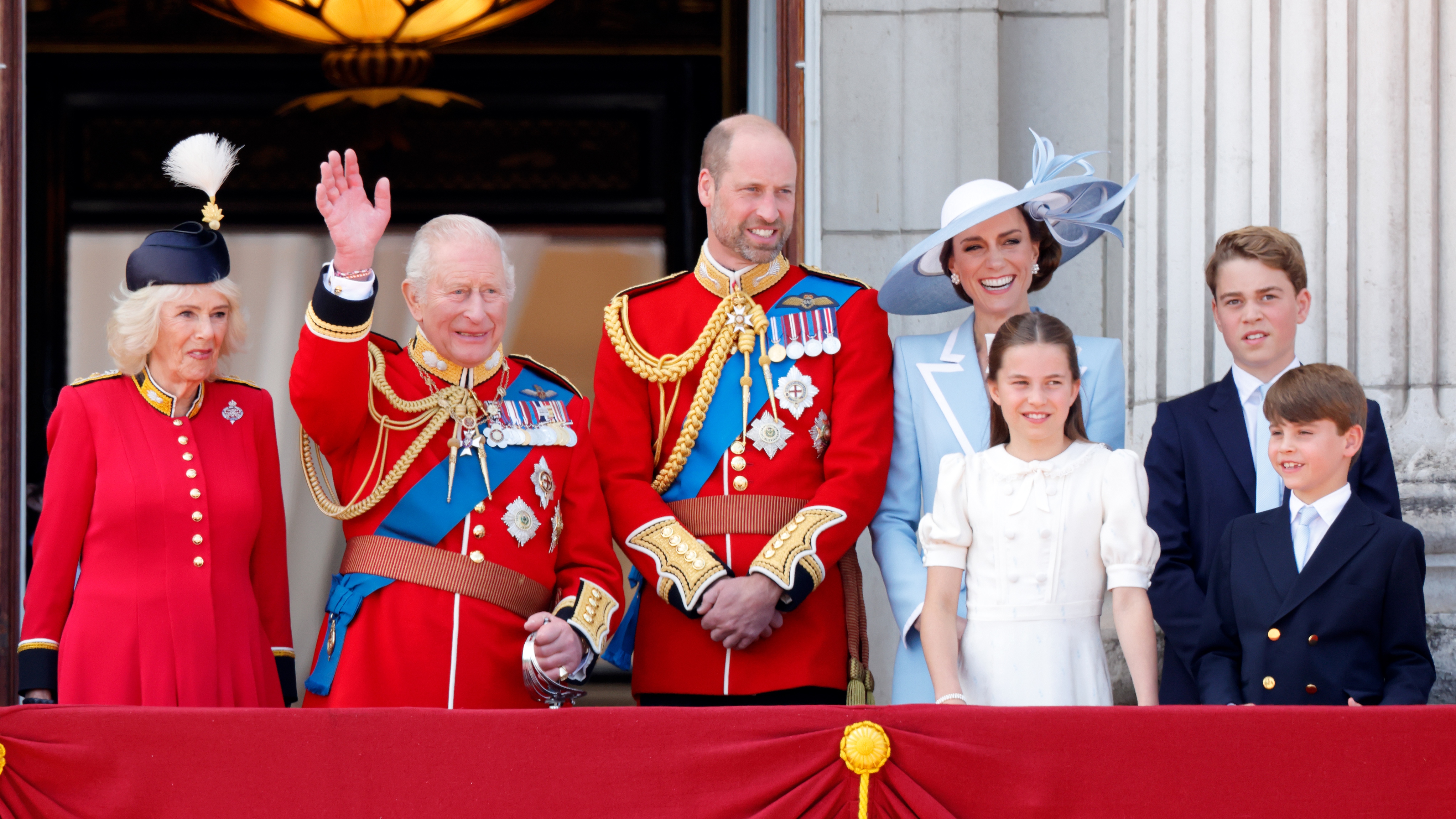 Queen Camilla, King Charles, Prince William, Catherine, Princess of Wales, Princess Charlotte, Prince George and Prince Louis watch an RAF flypast from Buckingham Palace on June 13, 2026