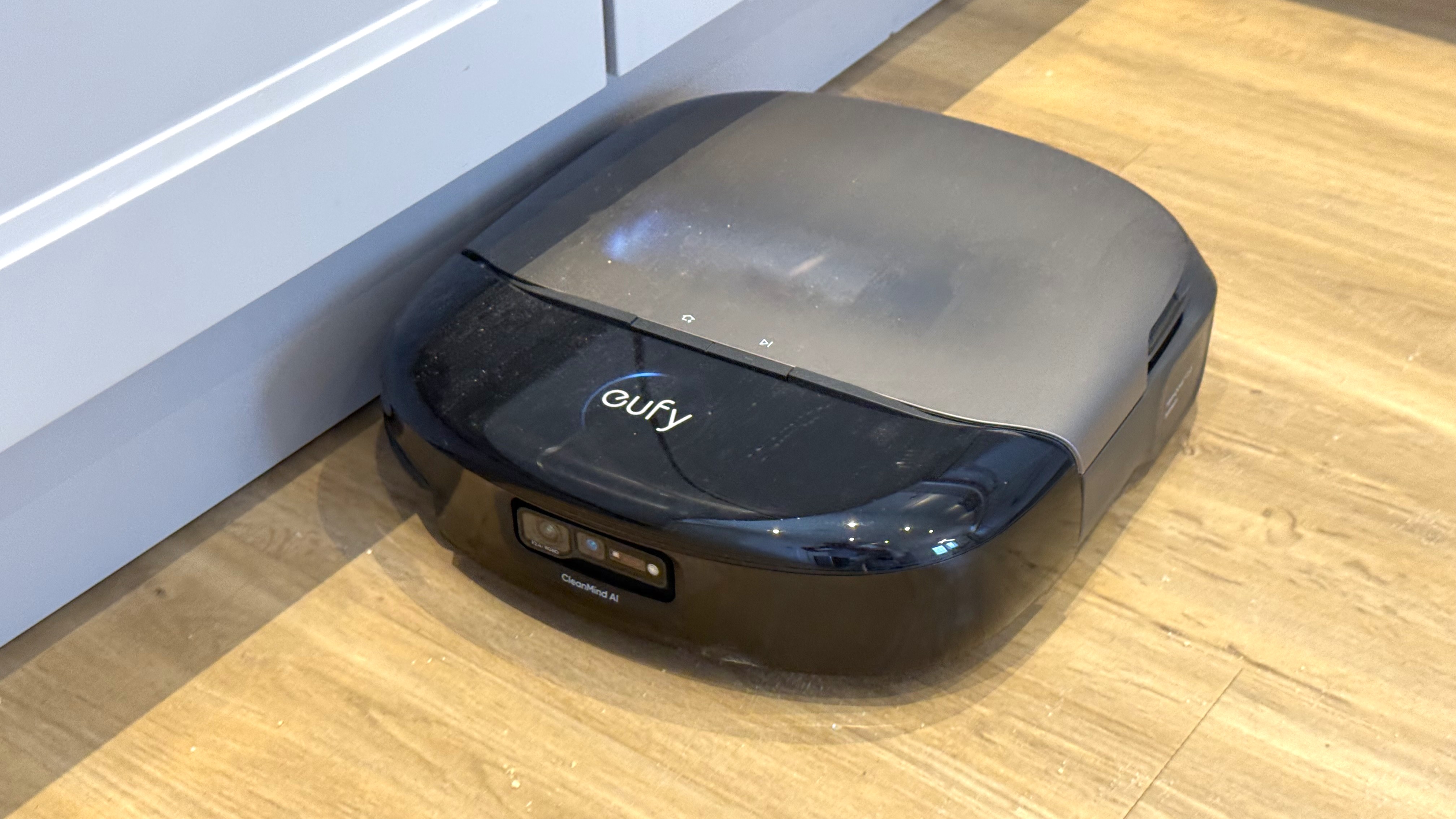 Eufy Omni S2 robot vacuum cleaning right beside a skirting board