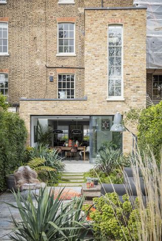 Exterior of Georgian townhouse with garden seating area