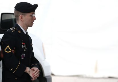 Chelsea Manning, known then as Bradley, escorted by military police