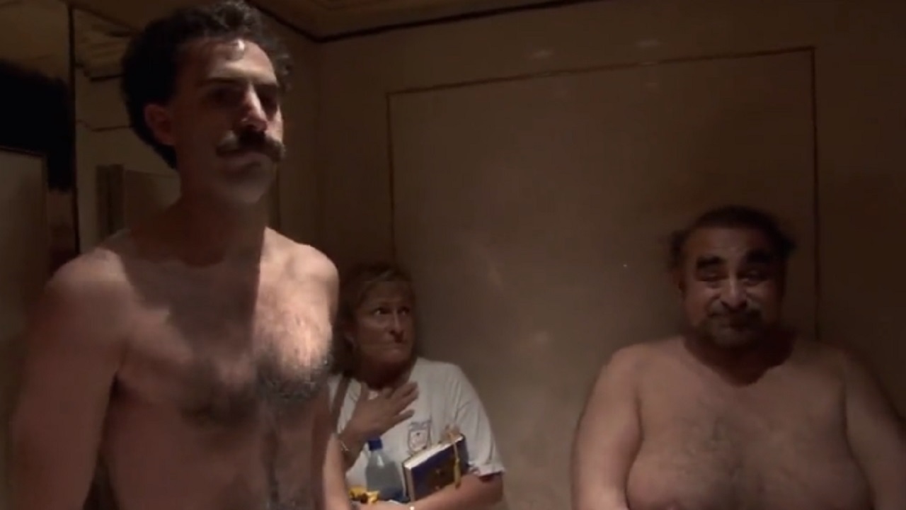 Sacha Baron Cohen and Ken Davitian naked in a hotel lift