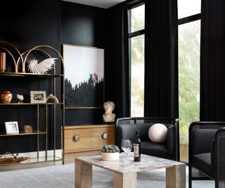 Black walls, chairs and curtains, marble table, gold shelves