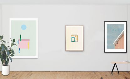 Three framed paintings on the wall