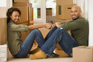 A man and a woman with moving boxes