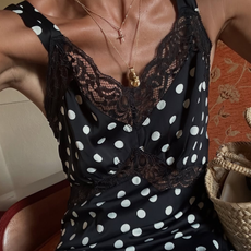 woman wearing polka dot and lace silk slip dress