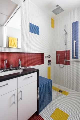 a bathroom with colorful mosaic tile