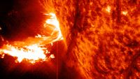 a huge fiery expulsion erupts from the sun. Large loops and swirls of bright light dance around the southeastern limb of the sun. 