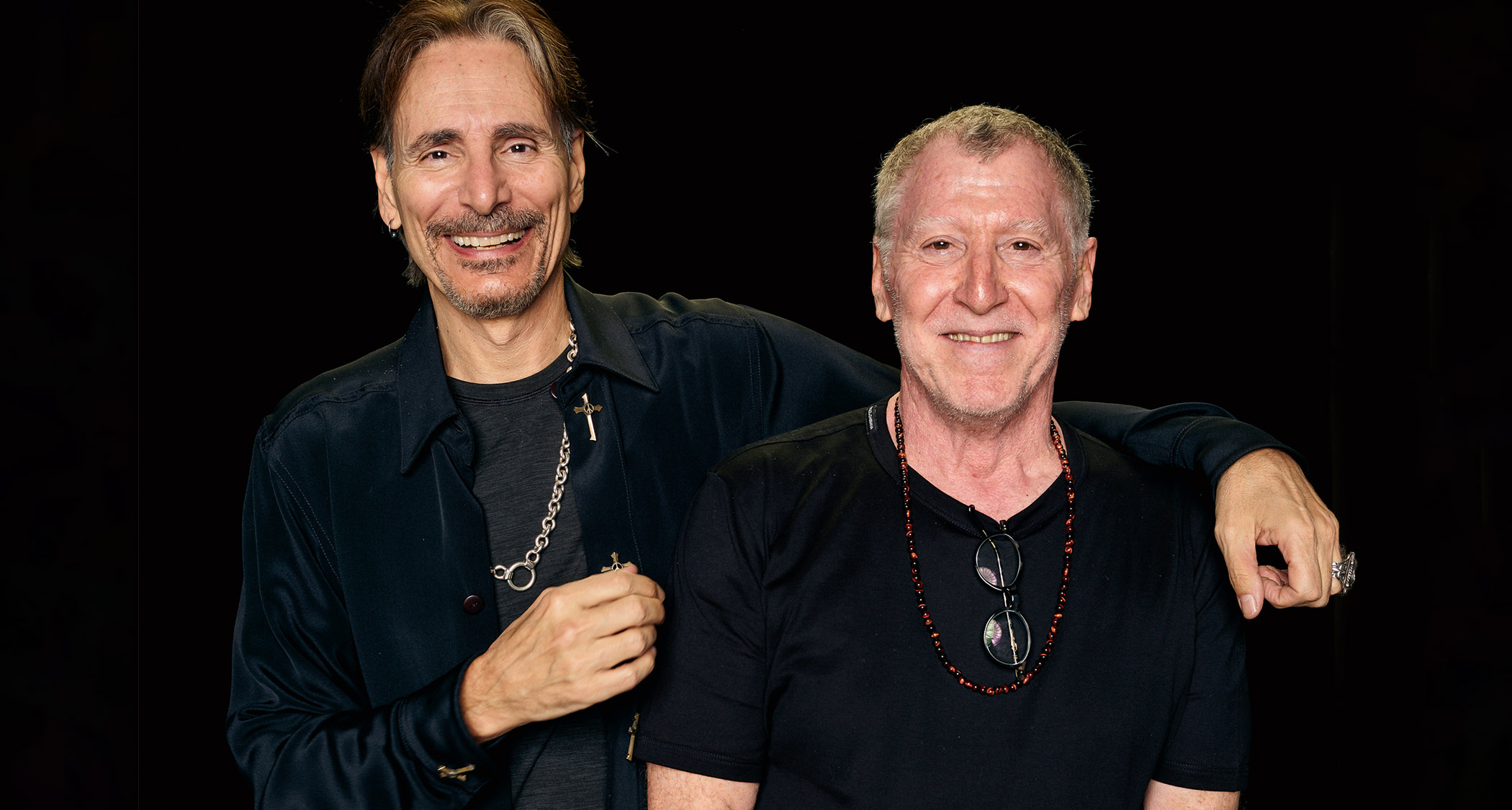Steve Vai and Larry DiMarzio pictured against a black backdrop.