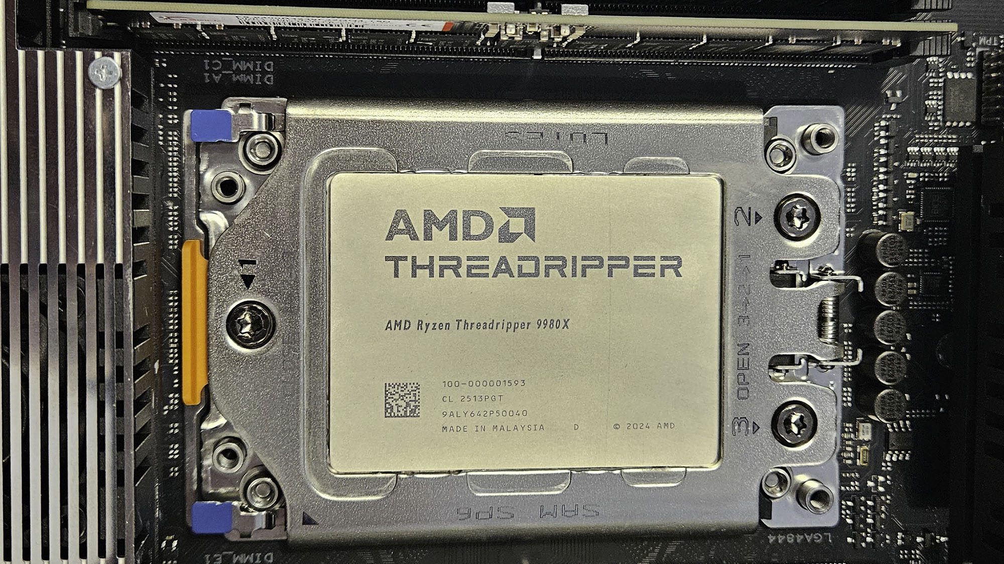 An AMD Ryzen Threadripper 9980X slotted into a motherboard