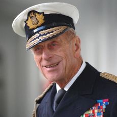 Prince Philip smirks while wearing his military uniform