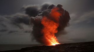 photo of a volcano erupting