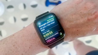 Apple Watch on a person's wrist showing a workout summary