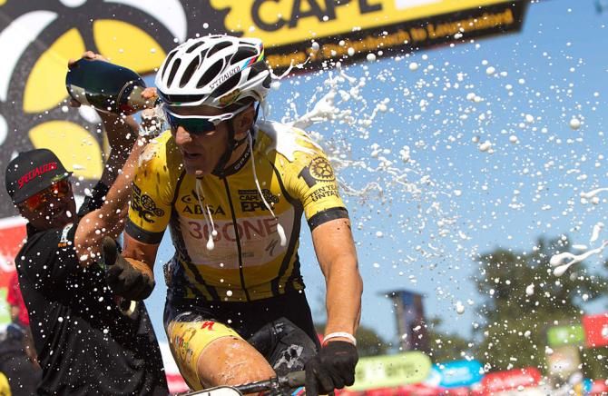 Jaroslav Kulhavy of Burry Stander-Songo is sprayed with Champagne in celebration as he and his partner Chrisoph Sauser win