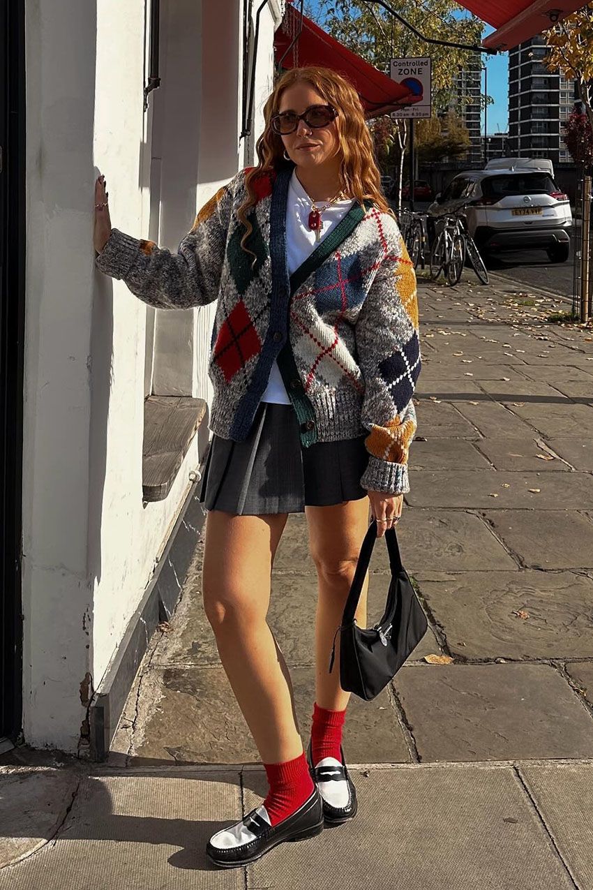 A woman wearing an argyle sweater.