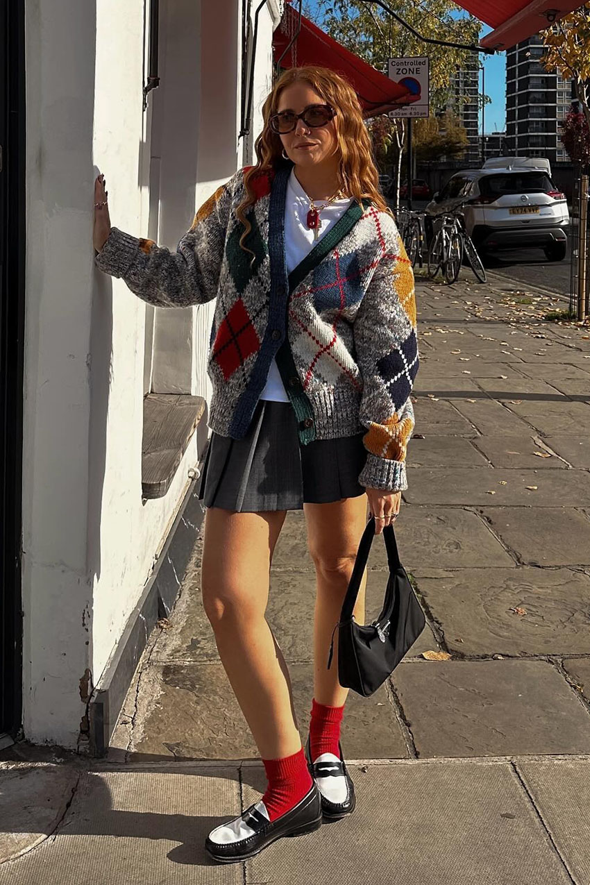 A woman wearing an argyle sweater.