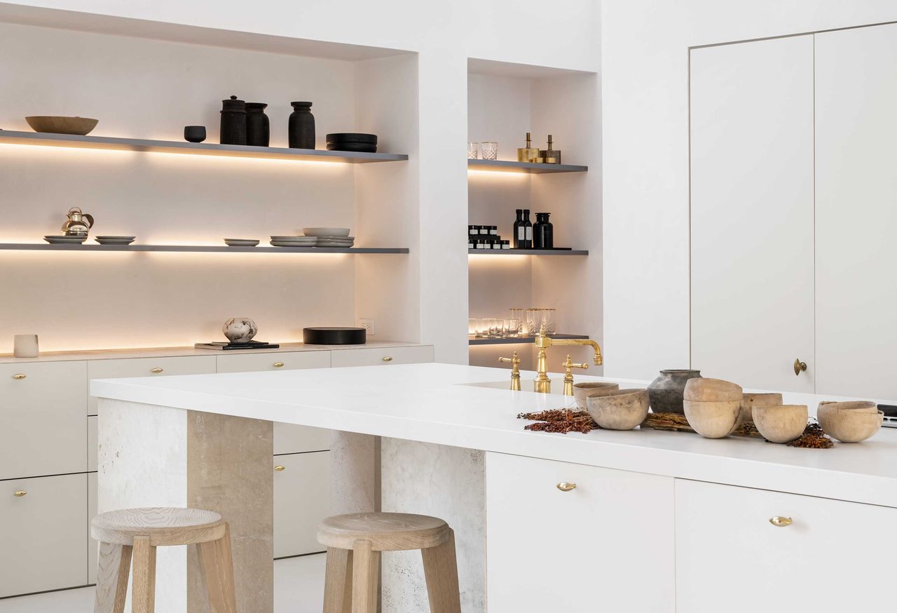 a kitchen with led lit shelves