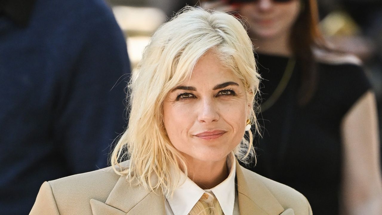 selma blair attends the schiaparelli show wearing a necktie made from braided blonde hair