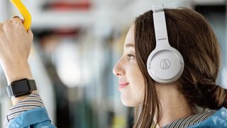 Audio-Technica ATH-S220BT worn by woman on train