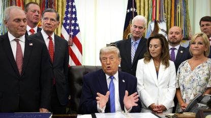 President Donald Trump signs ICE bill with congressional Republicans