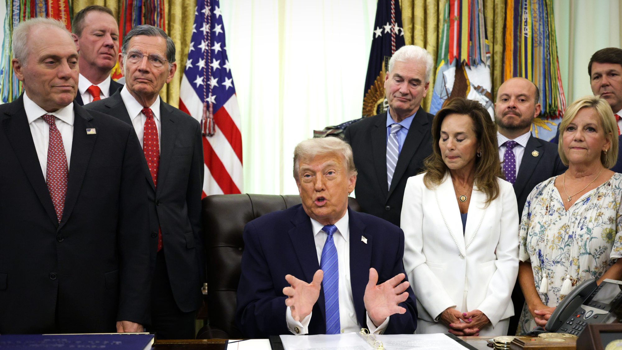 President Donald Trump signs ICE bill with congressional Republicans