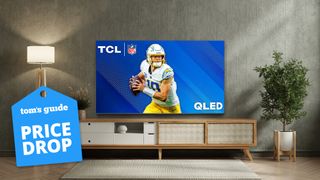 TCL Q68 on stand in living room